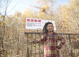 The dreadlocked Ishii Hideaki grins at the gate to the Kobayashi's property.  Photo 25 of 28 in A Platform for Living