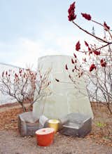 Located off of the library, the roof garden provides students with "a reflective space," Livesey says. "It's a place for getting away, to go outside, to be out of the building but still in it at the same time." The How High the Moon chair by Shiro Kuramata for Idee and the Stones tables by Maya Lin for Knoll offer a quite outdoor space in which to sit.