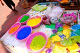 The Holi paints, sold in powder form, would later make their way from these tables onto my skin.