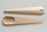 The Toss Around spoons differ from the Hang Around set as they are both spoons (rather than one spoon and one spatula), lack the slat in the back, and feature shallower spoons with a notch in one.