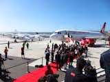 Virgin America is welcomed to its new home at SFO's Terminal 2 by Virgin Galactic's WhiteKnightTwo and a gaggle of press.