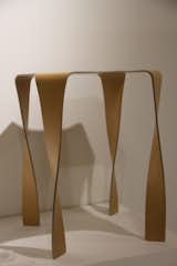 Designer Takaaki Tani, or t/m, based in Tokyo, displayed his plywood collection, entitled Wafft. The stool, shown here, boasts a sinuous form and a minimal amount of material.