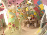This pastel room made of "trees" cobbled together from tires, beams, branches, and the like is still under construction. It also felt like I'd wandered into some Candyland version of the desert.