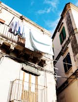 Gunnar Knechtel Photography, Italy, Sicily, Town: Syracuse, Island of Ortigia. The house of Francesco Moncada,Typical old hosue with cloth to dry hanging on the balcony in the streets of Ortigia.photographed on the 27+28,12.2010 for Dwell Magazine  Photo 19 of 20 in Less Is Amore by Aaron Britt