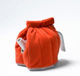A bright orange tea cosy by Jongerius Lab.  Search “officepod.html” from Friday Finds 4.15.11