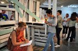 Visitors explore the writing environments at ArtSeen Gallery. Photo by Robby Campbell