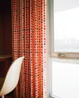 Alexander Girard’s Maharam Quatrefoil fabric is a vivid accent in Eero Saarinen’s Miller House in Columbus, Indiana.