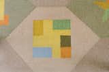 Girard even integrated the floor plan of the house into the TV room rug design.