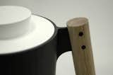The "dowel handle," the trio writes, "provides an ergonomic powergrip while contributing to the concept of cookware as 'tools.'"