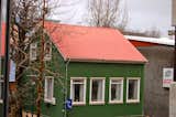 Around every corner it was common to spot unique shingle and roof color combos like this forest green and salmon house.  Photo 2 of 20 in Colors of Iceland by Bradford Shellhammer