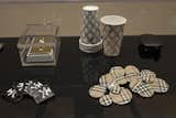 Another selection of objects on display including Unauthorized Burberry Buttons (1999). Burberry took to Wong's shenanigans and used the pins in one of their advertising campaigns. Photo courtesy SFMOMA.