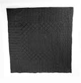 Wong's works grappled with perceptions of safety and security in post-9/11 America. This quilt is made from ballistic nylon, a material typically used in military applications as a protective shield from flying debris. Here, Wong uses the material in a quilt (a comforting object) with a rather traditional pattern, commenting on a need for a different sense of comfort and security.

Tobias Wong, 

Bulletproof Quilted Duvet, 2004, ballistic nylon, cotton, and cotton flannel; Collection SFMOMA, gift of Josee Lepage; © Estate of Tobias Wong; photo: courtesy SFMOMA.  Photo 6 of 7 in The Wong Show