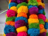 Colorful pompoms in all the vibrant colors found throughout the fair.  Photo 16 of 32 in Color Me Mad! from Peru Gift Show 2011