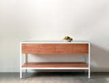 The 'Farmhouse Modern' sideboard shown here is made from sycamore, heavy gauge stainless steel and white powder-coated steel. The sideboard is also available in other woods and colors such as Oregon walnut with black powder coated steel.