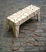 Rope Bench by Yoav Reches. "This plywood bench has been constructed using only rope tension. The system, which features the rope embedded directly in the plywood, can either lie flat or be realised into a complete seating unit."