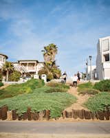 The trio walks down to the beach via the strand.  Photo 3 of 18 in Less is More in this Manhattan Beach Bungalow