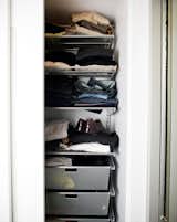 Elfa storage systems fit perfectly behind the sliding doors, and offered customizable options for keeping clothes organized.  Search “the-ushelf-system.html” from Less is More in this Manhattan Beach Bungalow