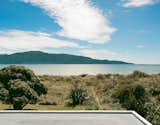 Outdoor, Grass, and Back Yard The view of Kapiti Island is fully revealed from the tower.  Search “editors-top-picks-selected-seating.html” from Bach to the Beach