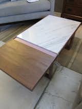 I am rather smitten with this wood-and-marble coffee table.