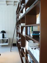 The showroom’s System NXT is outfitted with a library ladder and a multitude of design books.