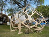 Next to Google's big setup of shipping containers turned into shelters were a few more modest outdoor structures, such as this module wooden hut by Zome Builder.