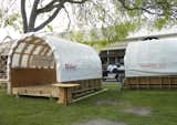 These curved-roof structures are the first of an envisioned series of Makerspaces. Developed by Robert Bridges and Bill Young, of ShopBot, a Makerspace is a place, perhaps in a backyard or public park, for kids to craft and create and start DIYing early in life.  Photo 4 of 17 in Maker Faire 2011 by Miyoko Ohtake