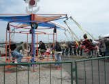 There were lots of solar- and human-powered projects to see. The parents of the four kids on this Cyclecide swing ride powered it by riding stationary bicycles.  Photo 16 of 17 in Maker Faire 2011 by Miyoko Ohtake