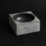 Poul Kjærholm originally designed this granite bowl as a 550-pound ashtray for the city hall in Fredericia, Denmark. This smaller version, which weighs 6.5 pounds, can be used for holding everything from fruit to business cards to jewelry.