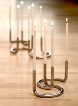 Peter Karpf's modular candleholder can be arranged in what seems like infinite combinations. The U-shape Gemini holds two candles and stands elegantly on its own or in a group, as shown here.