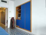 Blue laminate is also featured prominently in the built-in cabinetry.