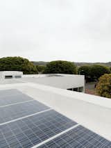 The roof features a cool roof, which reflects heat back to the sky rather than having it absorbed into the house, and 26 solar panels that often cause the meter to roll backward.