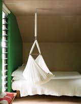 For now, one-year-old Awa is small enough to sleep in the hammock that hangs from the ceiling.