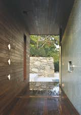 Next to a house in Wilton, Connecticut, architecture firm Hariri & Hariri designed the sculptural Pool House. The ipe wood frame extends beyond the 1,200-square-foot enclosure and encloses the outdoor showers (shown here).

Photo by Tim Hursley.  Photo 3 of 8 in Nature Framed by Miyoko Ohtake