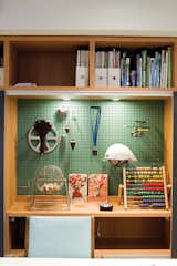 John built a shelf system for the basement when it was Anne’s office; he adapted it to store the kids’ toys when the area became a playroom.