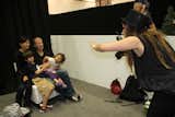 Sarah Strack Anderson of Modern Day Moments photographs a family at the Modern Family Zone.