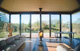 Living Room, Wood Burning Fireplace, and Sofa Architects: Kirsten Murray, Tom Kundig  Search “greetings-from-houston-tx.html” from A Minimal Writer’s Retreat in the Pacific Northwest