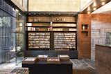 The new walls of La Formiga d'Or do more than just house the inventory of reading materials—they invite one's eye to wander up and through the dramatic space.