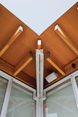 The visible structural engineering is part of the beauty of the home’s design. At the roof corner, a double-channel steel hip beam and cantilevered wood rafters come together like pieces of a puzzle.
