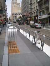 Here you can see a bike locked to one of the barriers between a parklet and the street. Hood loved that the space is already being subjected to the whims of a bustling cityscape. When the biker came to retrieve his bike Hood asked somewhat facetiously if he liked the new bike rack. The cyclist replied that it would work better if it were a bit lower.
