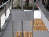 Here's the only real Audi branding on the eight parklets. It's a plaque on one of the solar collectors. I talked with Audi PR man Andrew Lipman and he told me that the car company loves this project because, "It's a project that solves a problem and gives back to a community that we care about." As to why there aren't Audi rings stamped on every surface, he said that the parklets aren't a massive branding exercise. "It's OK if people don't understand it as 100% related to Audi."