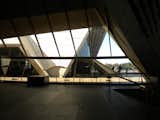 This photo shows the view from the Concert Hall foyer toward the Opera Hall through the glass windows. After Utzon was dismissed as chief architect, he never returned to Sydney and never saw the completed Opera House. In 1999, however, he worked on the building again to create design principles to guide all future changes to the structure, which was added to the World Heritage List in 2007.