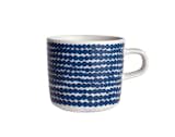 Her Siirtolapuutarha Räsymatto pattern features a whimsical, off-kilter pattern of dots. Here it's applied to a porcelain cup.  Photo 9 of 13 in Marimekko's Iconic Patterns by Miyoko Ohtake