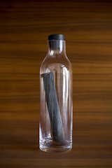 Despite its message-in-a-bottle appearance, this product is in fact a glass carafe and stick of kishu binchotan (coal). The coal purifies drinking water and improves its overall taste.