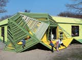How fun is the Tuka-Tuka-Land kindergarten in Germany? Designed by Die Baupiloten, the building features irregular climbing and hiding structures that burst out of the exterior walls.