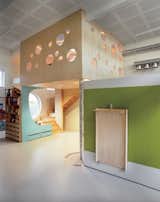 Several of the Tromsø kindergartens feature hinged walls, like the one shown here. These movable partitions create the opportunity to divide spaces into large or small areas. The walls also feature built-in furniture, drawers, whiteboards, climbing walls, and more.