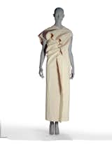 Here's another design by Kawakubo for Comme des Garcons that is defined by a series of slots that once filled create a splendidly textured garment. The dramatic draping is made with twenty sheets of beige binding. It's from the Spring/Summer 1998 collection.
