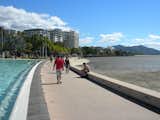 Cairns is a waterfront tourist town and retreat for Aussies escaping the winter weather. Though on the coast, it lacks a proper beach due to its large, long mud flats. Instead, the center of town features the Cairns Esplanade Pool, a public saltwater pool/fountain/lagoon.
