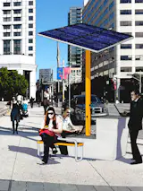 This rendering shows details of the Clean Energy Public Docking Station project. Here, solar panels would power public outlets and wireless connections and the supporting structure would offer seating and work spaces.
