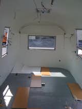 Then they put the inner skins back in, painted the walls and ceiling, and installed new cork flooring.  Photo 5 of 7 in a i r s t r e a m by See Spot Run from Big Sur Airstream Renovation