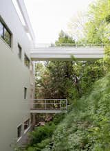 There are two walkways that extend over the sloping hillside. The top-most walkway is the intended entrance.